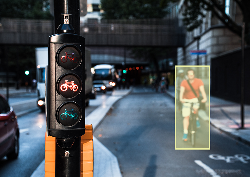 Annotated pedestrian cyclist near bike traffic light