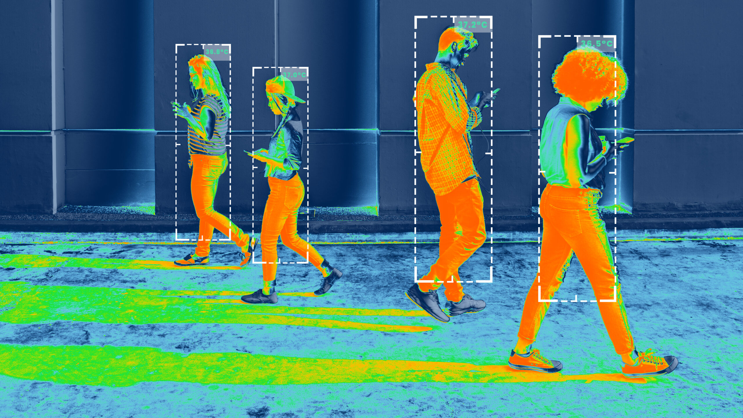 Thermal image showing people with temperature detection boxes.