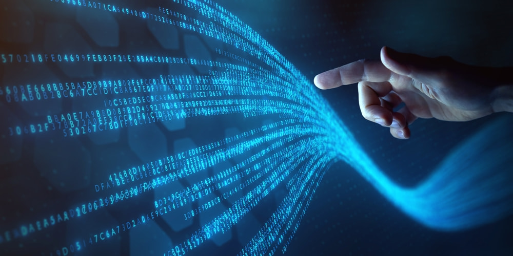 Big data technology and data science with person touching data flowing on virtual screen.