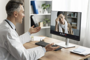 A doctor conducting remote patient monitoring through teleoperation video consultation