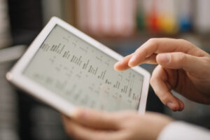 Healthcare worker reviewing medical data for healthcare tele-operations